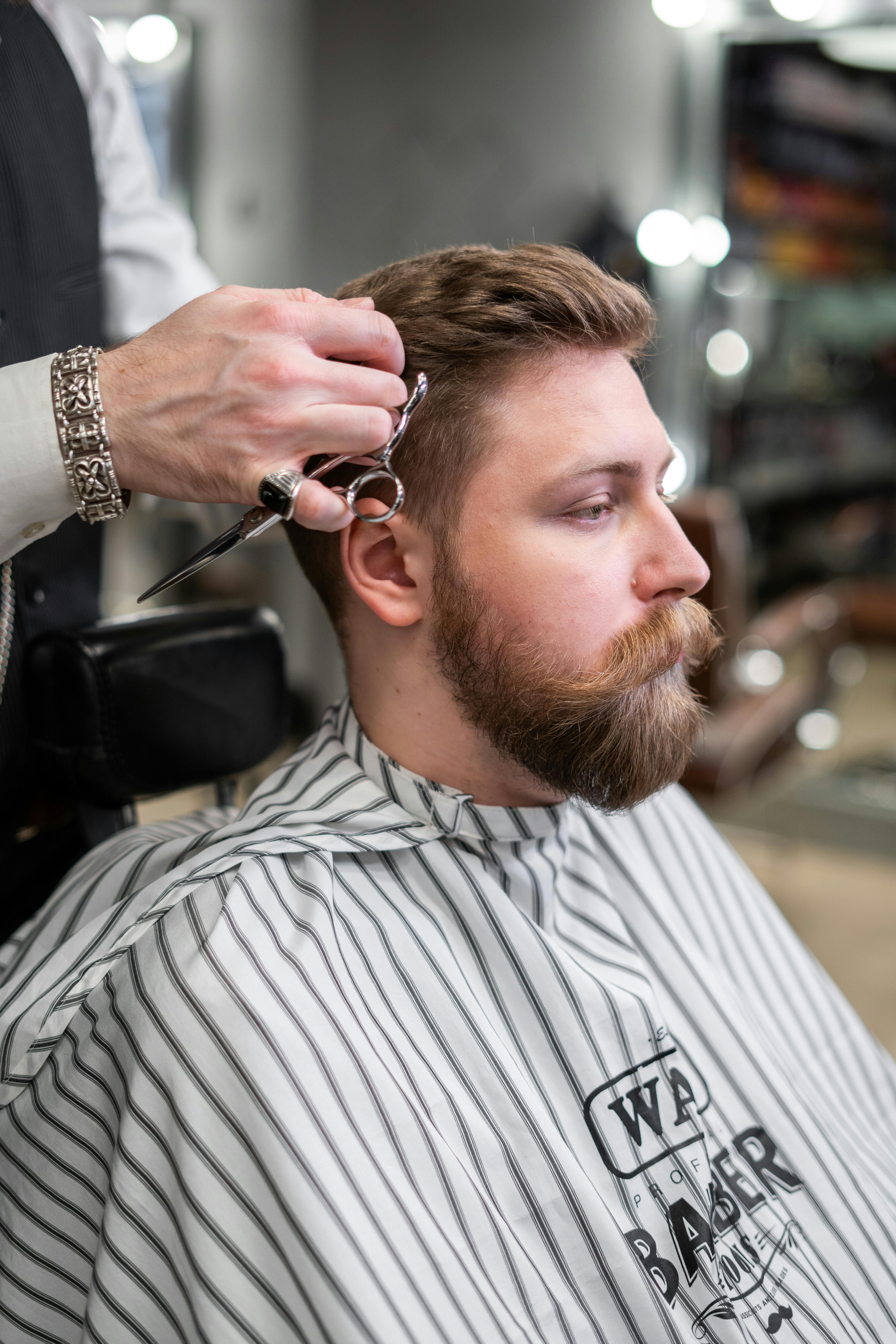 Men’s haircut at a barbershop — clipper fade and trim